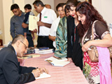 Dr Amyn B. Sajoo signing books at the Leicester book launch IIS 2011.