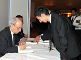 Dr Farhad Daftary Editor signing A Modern History for an IIS volunteer IIS 2011.