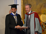 Professor Richard Andrews pesenting Anil Ali with the Outstanding Student Award, IIS 2014. 