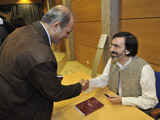 Dr Reza Shah-Kazemi signing the Portuguese translation of Justice and Remembrance IIS 2011