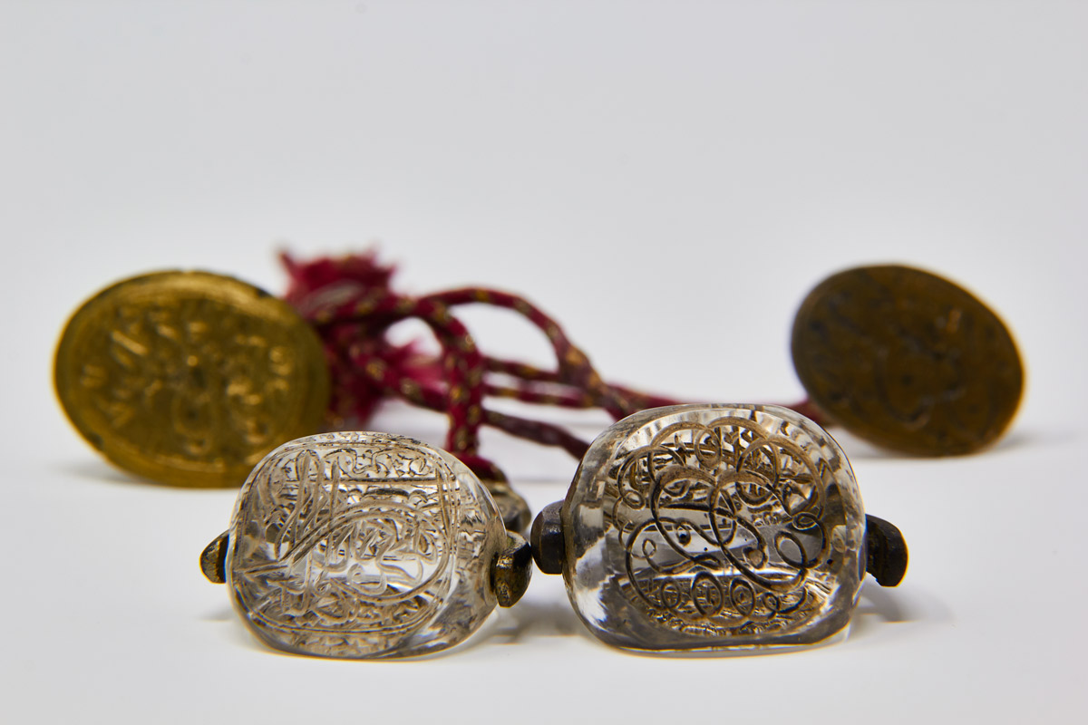 A set of two rock crystal three-faced seals and two metal seals from Aga Khan I (c. 1258-1283 AH/1842-1866 AD)