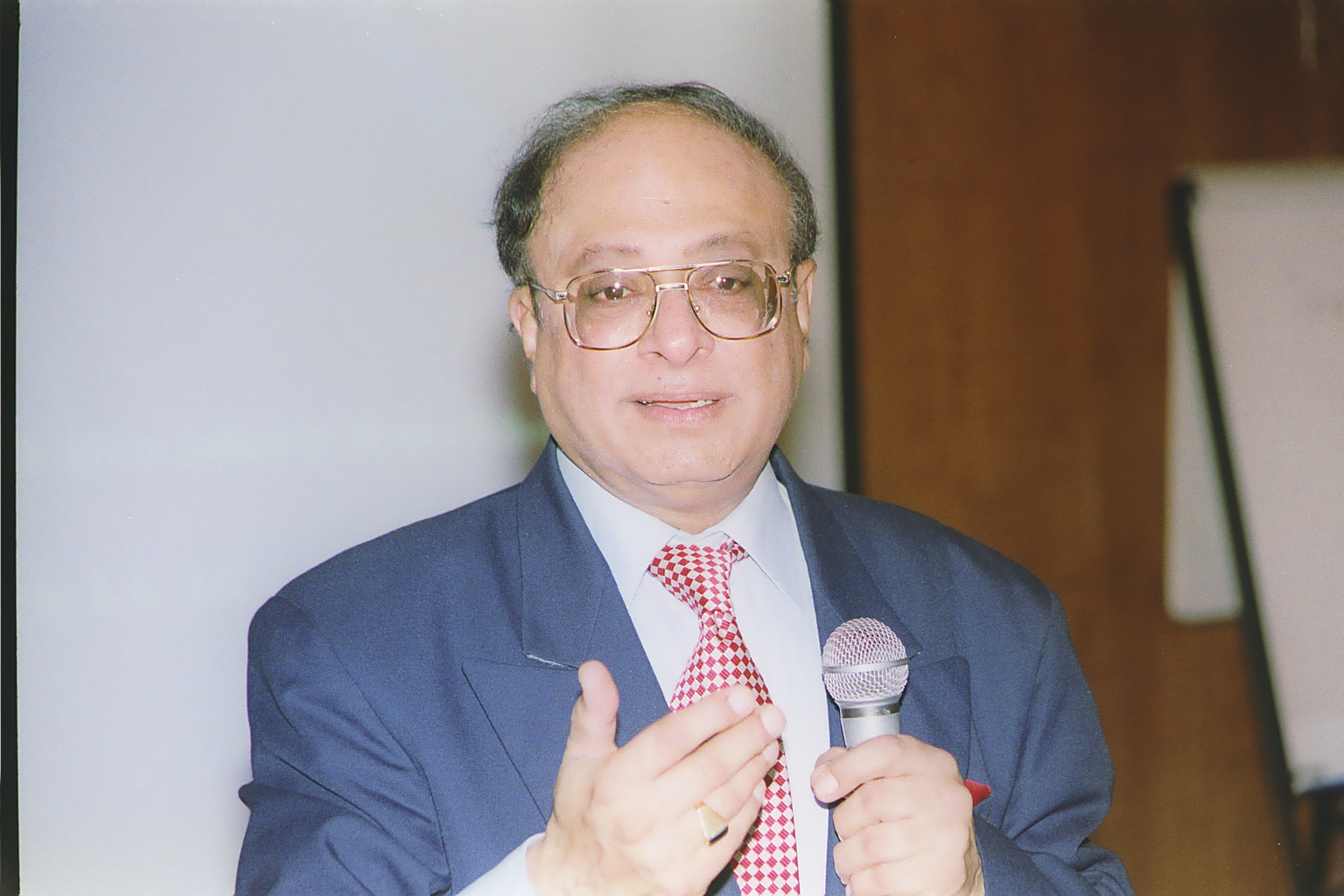 The Late Dr Karim Janmohamed giving at presentation at The IIS